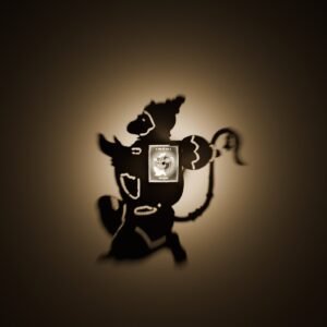 Hanuman shadow lamp casting a large Hanuman ji shadow on the wall at night
